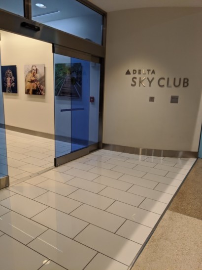 a glass door with a sign on the wall