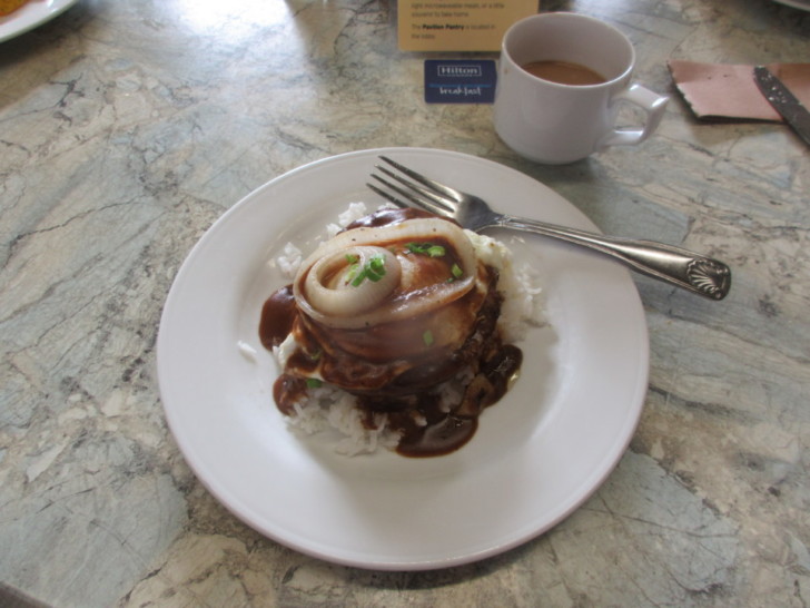 a plate of food and a cup of coffee