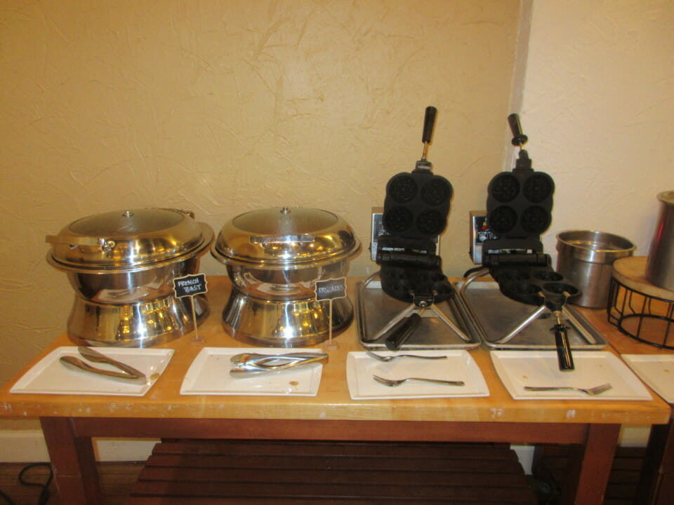 a table with a few waffle maker and a waffle maker