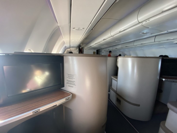 a tv on a table in an airplane
