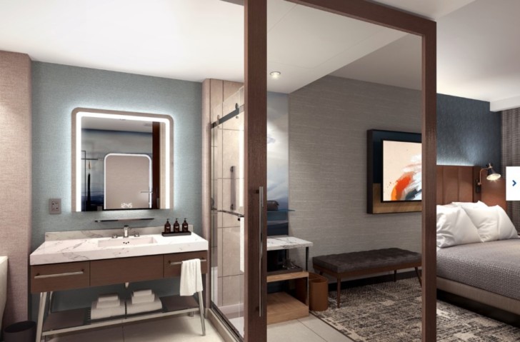 a bathroom with a mirror and a sink