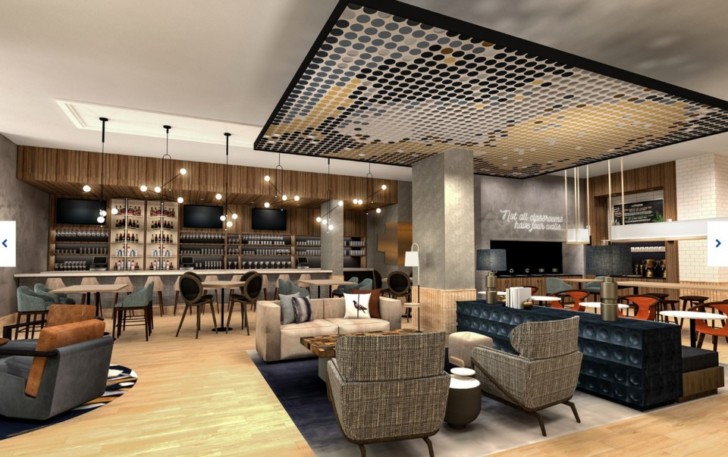 a room with a bar and chairs