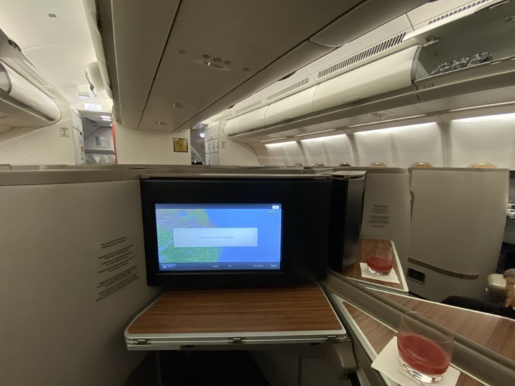 a tv on a table in an airplane