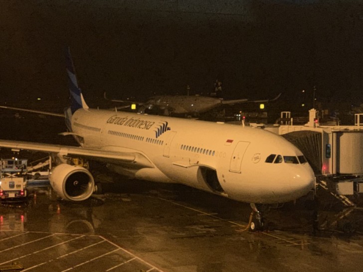a large white airplane at an airport