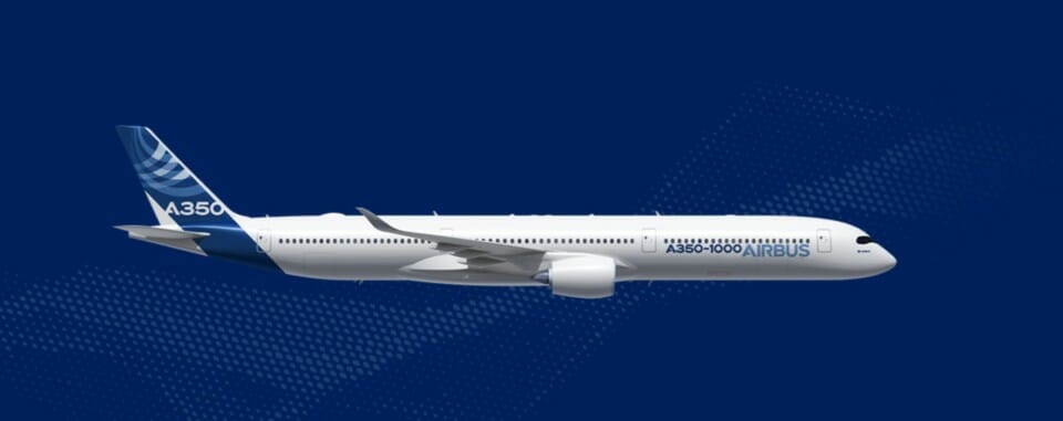 a white airplane flying in the sky
