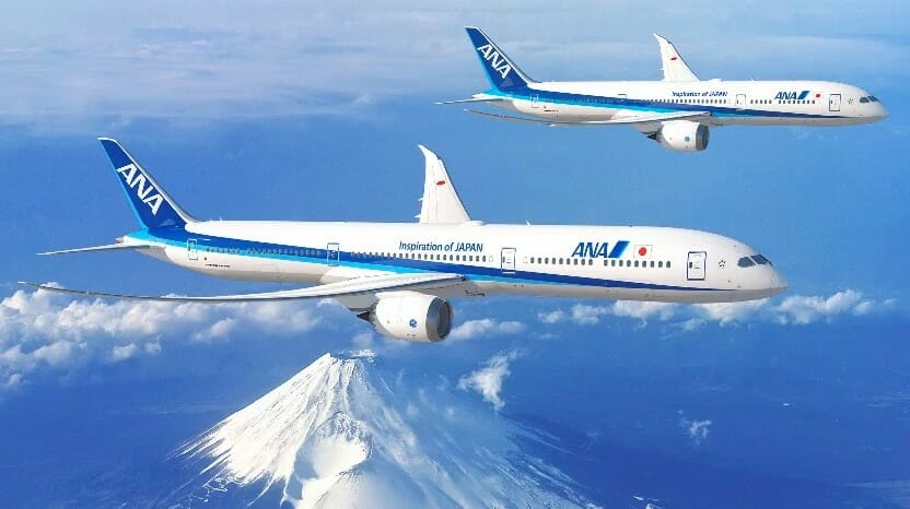 two airplanes flying in the sky