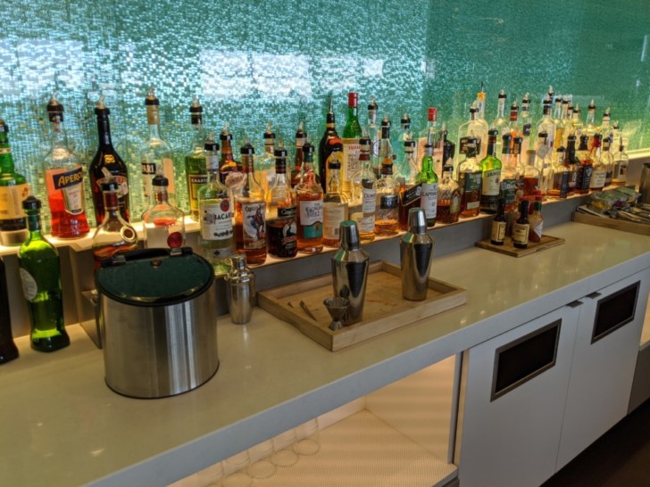 a bar with many bottles of alcohol