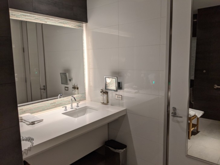 a bathroom with a mirror and sink