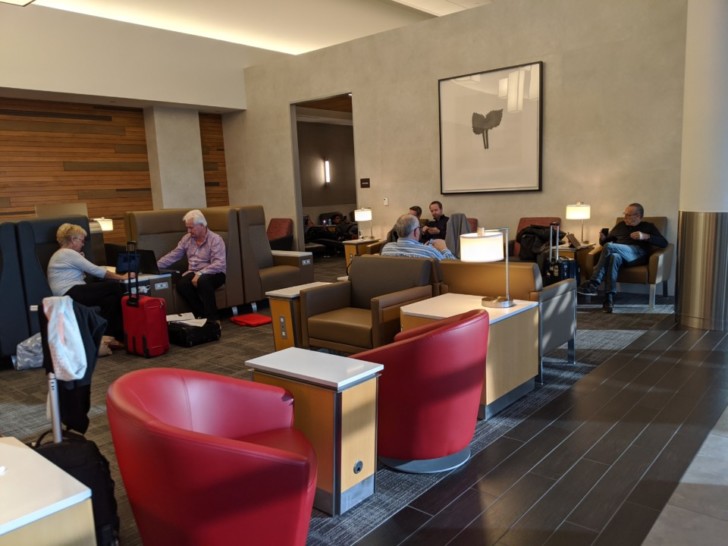 a group of people sitting in a lounge area