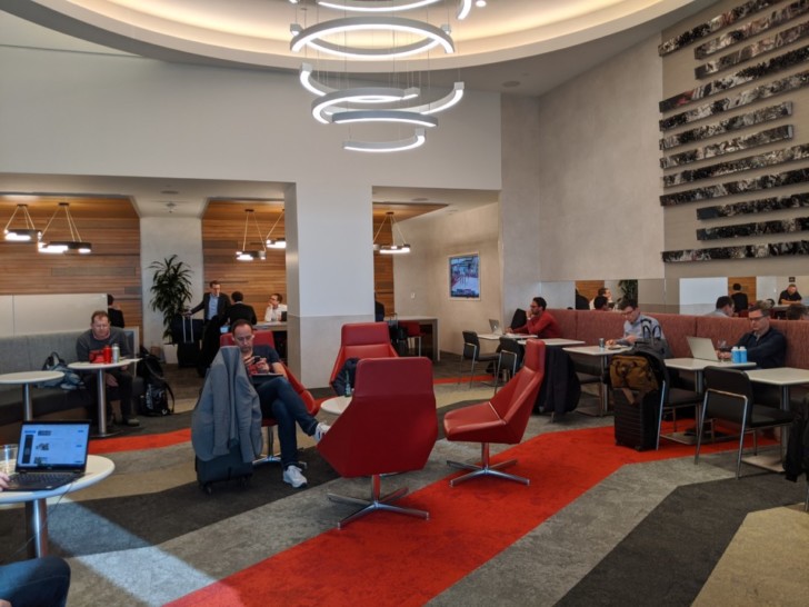 people sitting at tables in a room