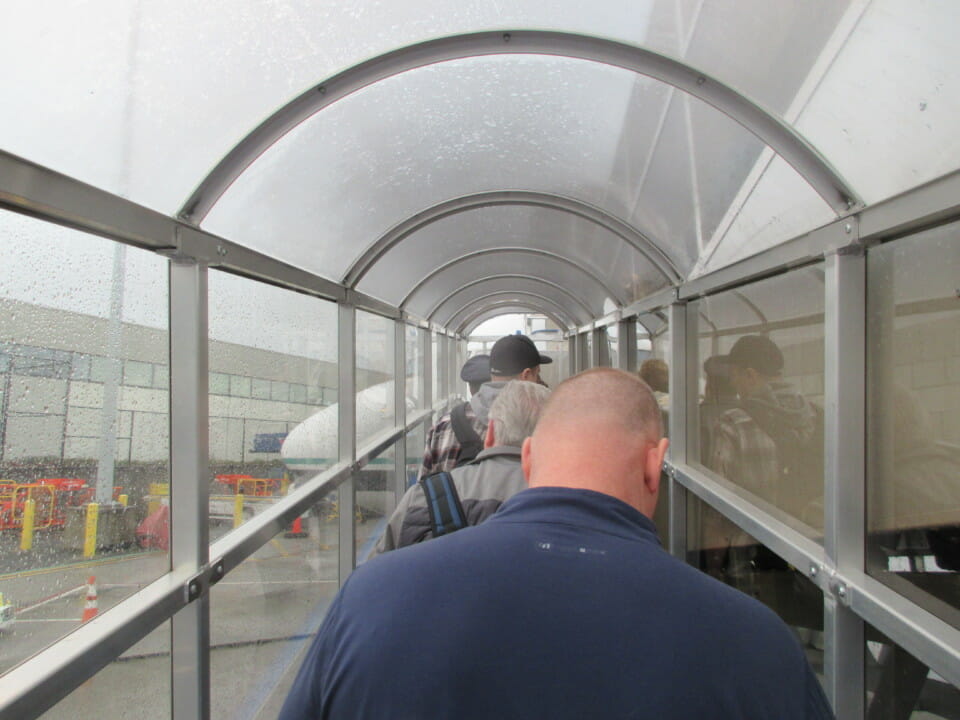 a group of people walking down a walkway