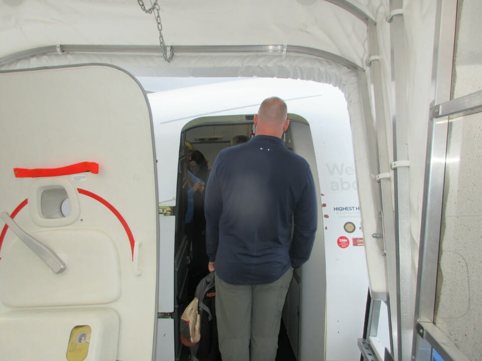 a man standing in a white tent
