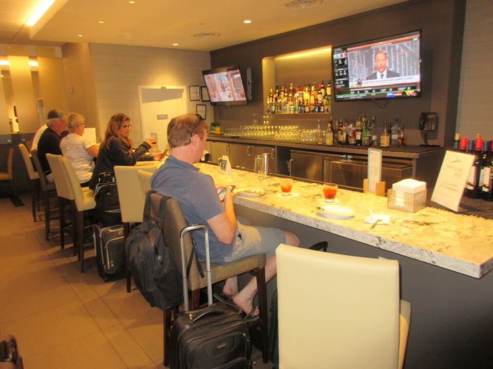 a group of people sitting at a bar