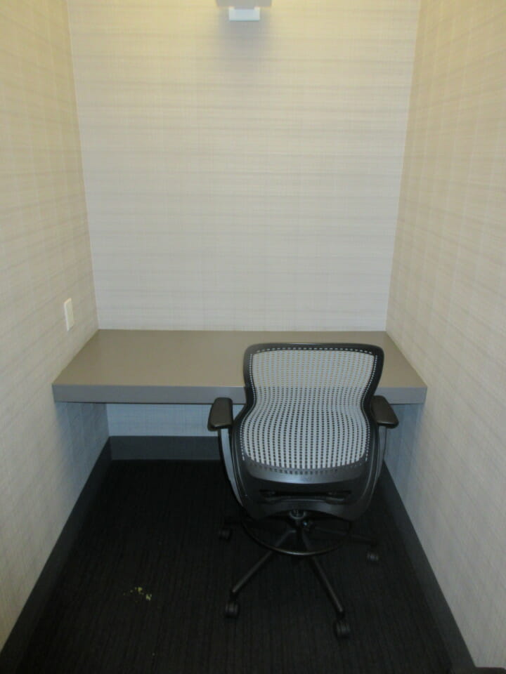 a chair in a corner of a room