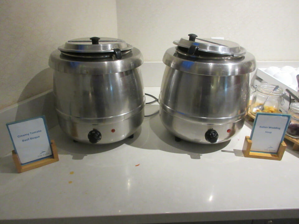 two large metal containers on a counter
