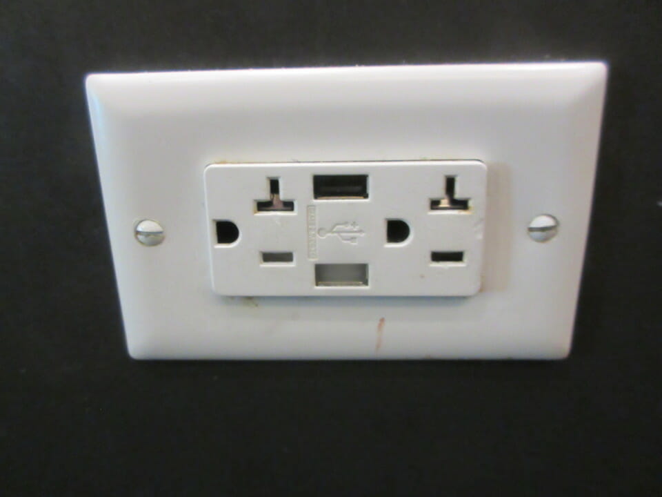 a white outlet with a usb port