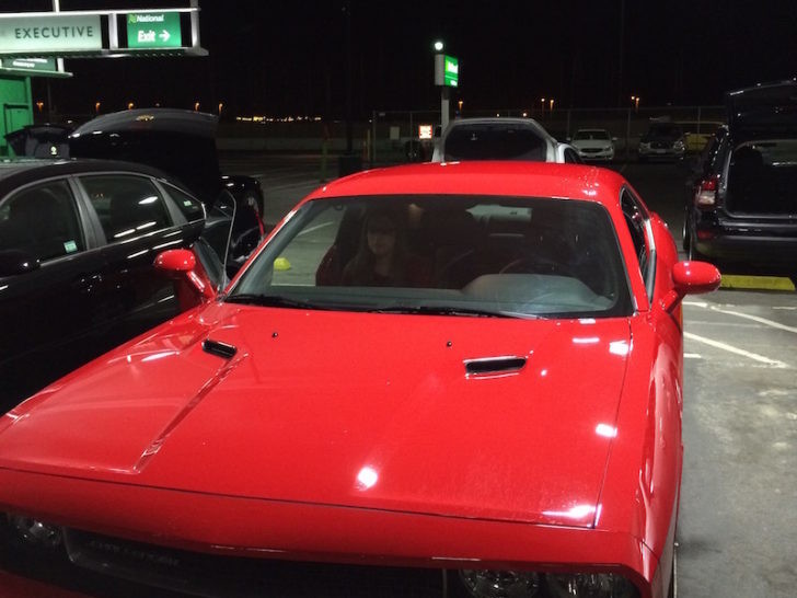 a red car parked in a parking lot