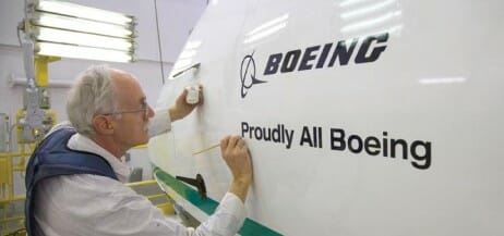 a man writing on a plane