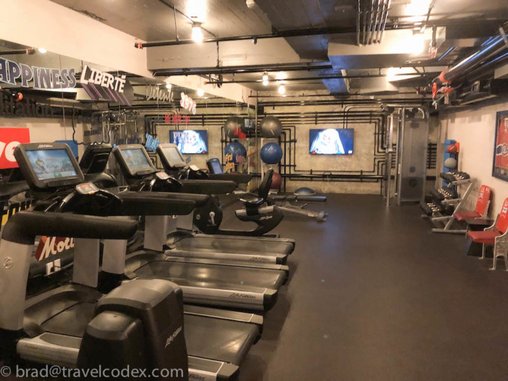 a gym with treadmills and exercise equipment