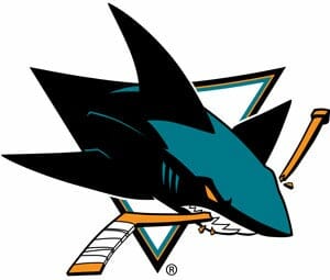 a shark logo with a stick