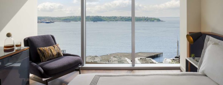 a room with a large window overlooking the water