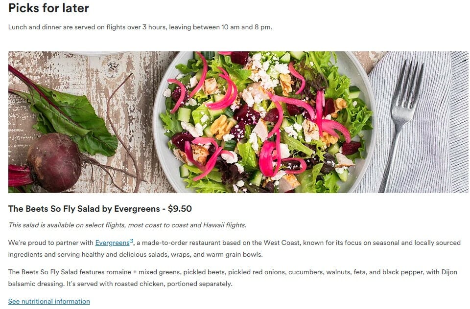 a plate of salad with fork and knife