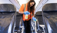 a woman cleaning an airplane