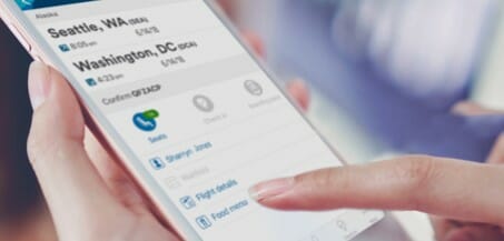 a person's hand touching a phone screen