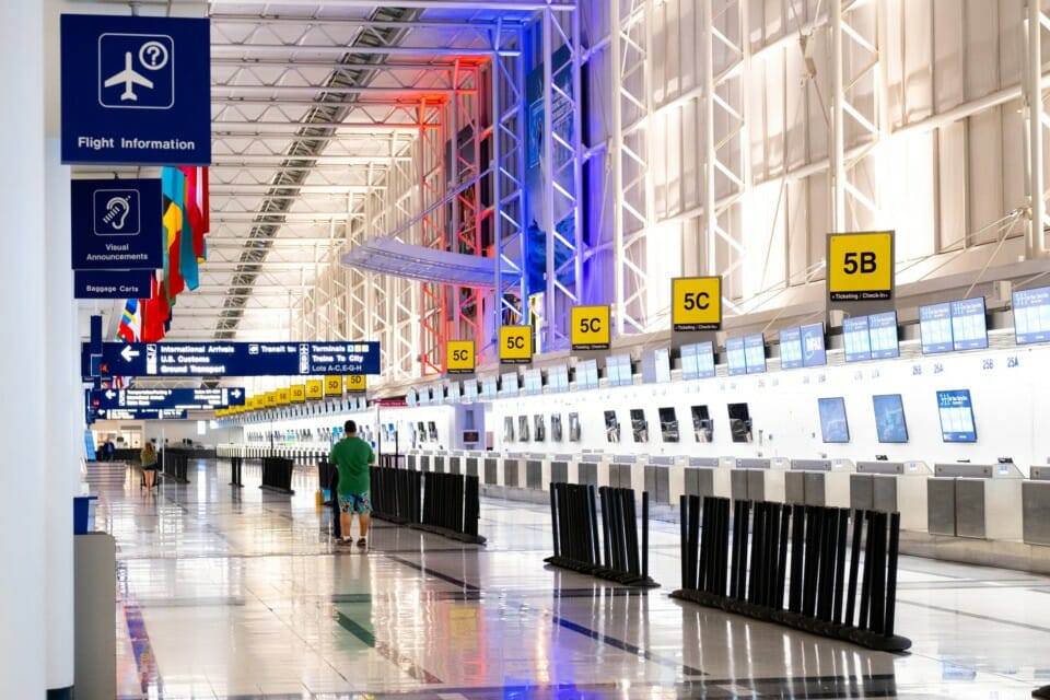 a man walking in a large airport