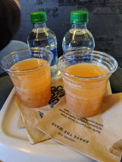 a group of plastic cups with liquid in them