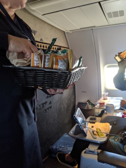 a person holding a basket of food