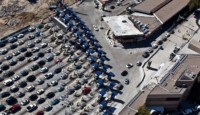 a parking lot with cars and buildings