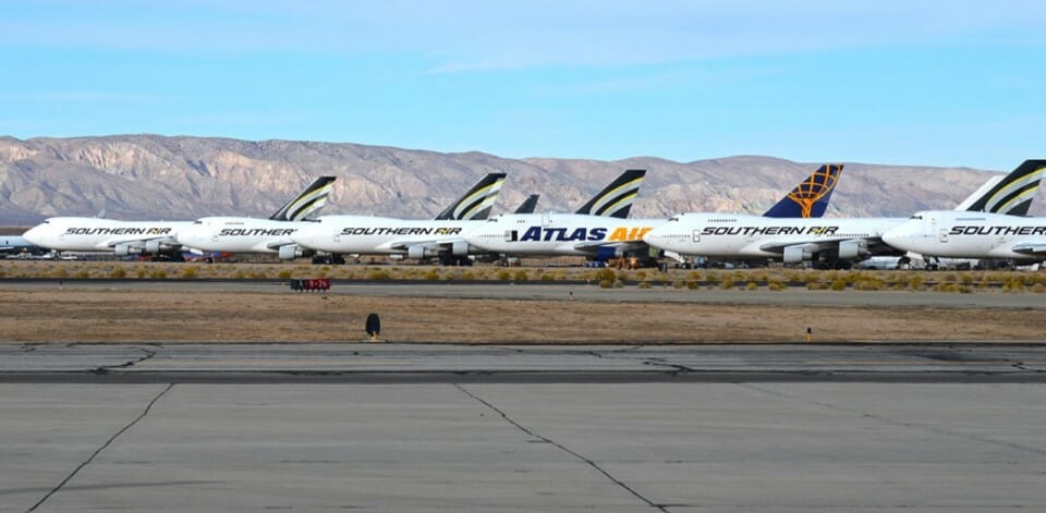 a group of airplanes on a runway