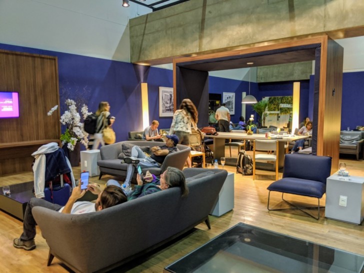 people sitting on couches in a room