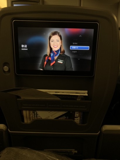 a tv screen on an airplane