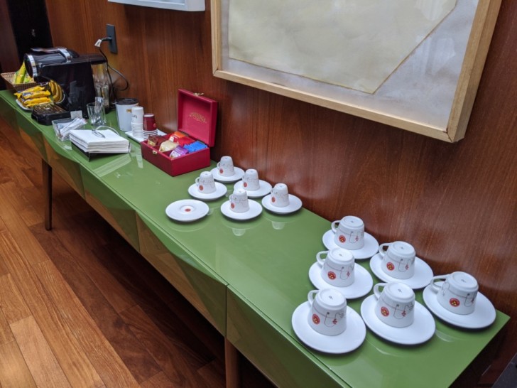a table with tea cups and saucers