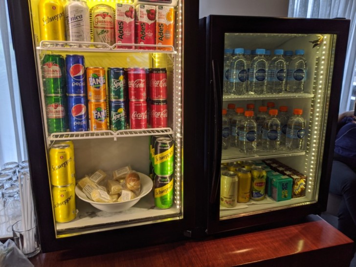 a refrigerator with drinks and beverages
