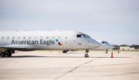 a group of airplanes on a runway