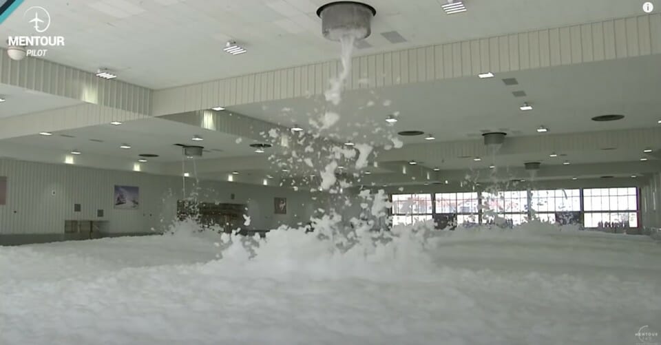 a large room with foamy water pouring out of it