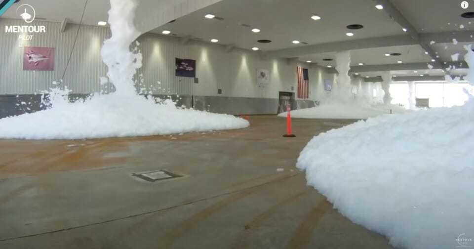 a large room with snow on the ground
