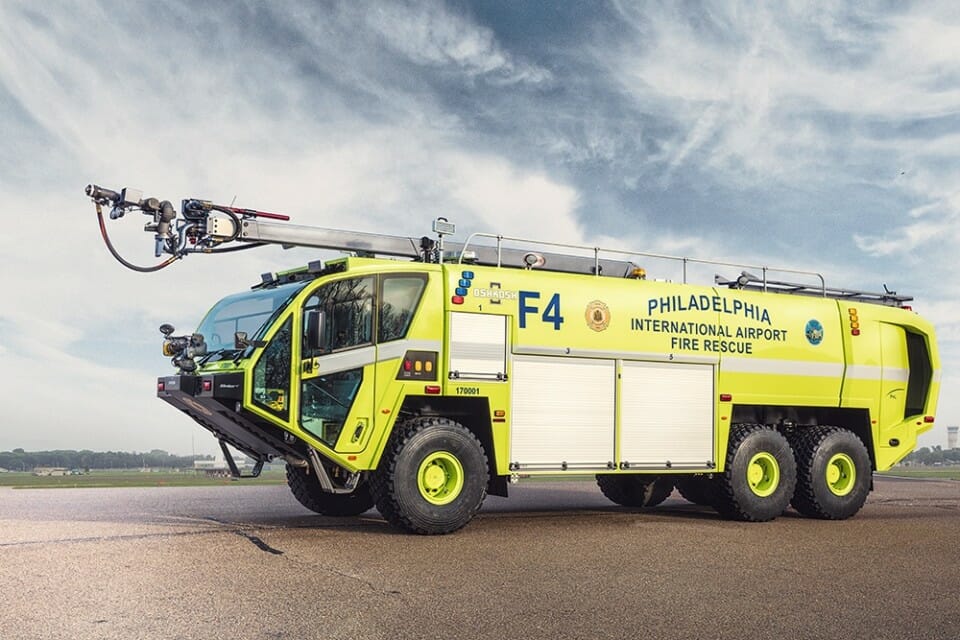 a yellow fire truck on a road