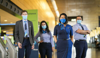 a group of people wearing face masks