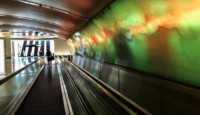 a person walking on an escalator
