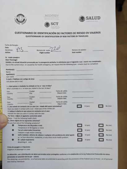 a hand holding a paper with text