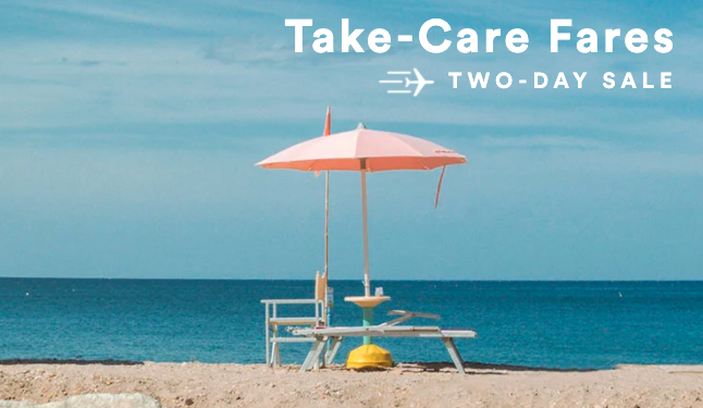 a beach chair and umbrella on a sandy beach