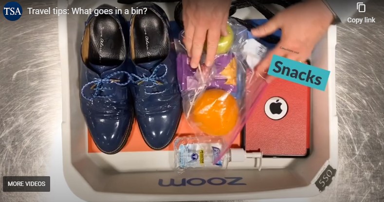 a person's hand and a bag of food