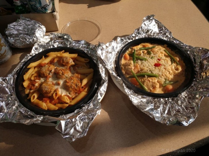 two bowls of food on foil