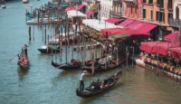 a group of boats on a canal