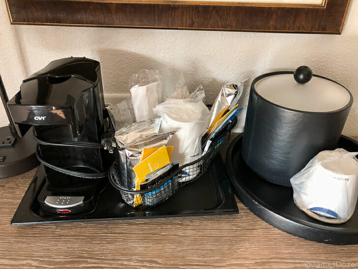 a coffee maker and other items on a table