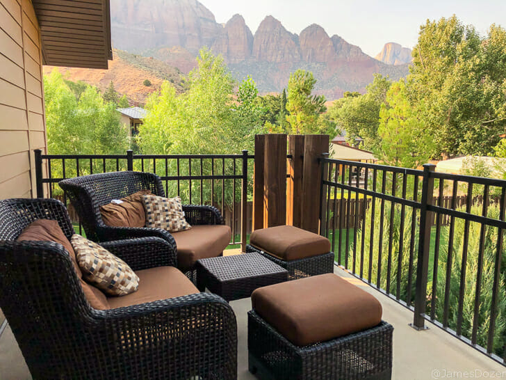 a patio with chairs and a table